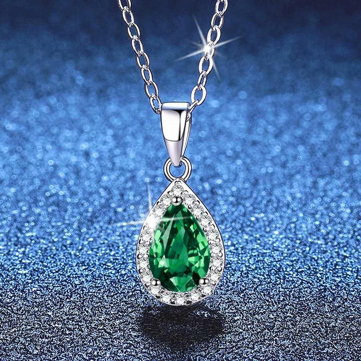Oval Lab-Grown Gemstone and Moissanite Pendant Necklace in White Gold-Plated S925 Sterling Silver blue background styling view