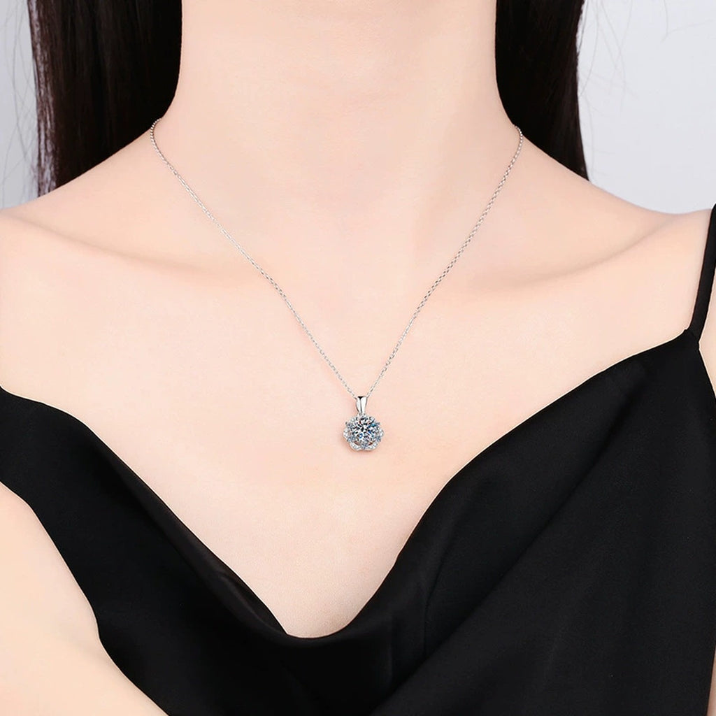 round moissanite floral halo pendant necklace worn by model