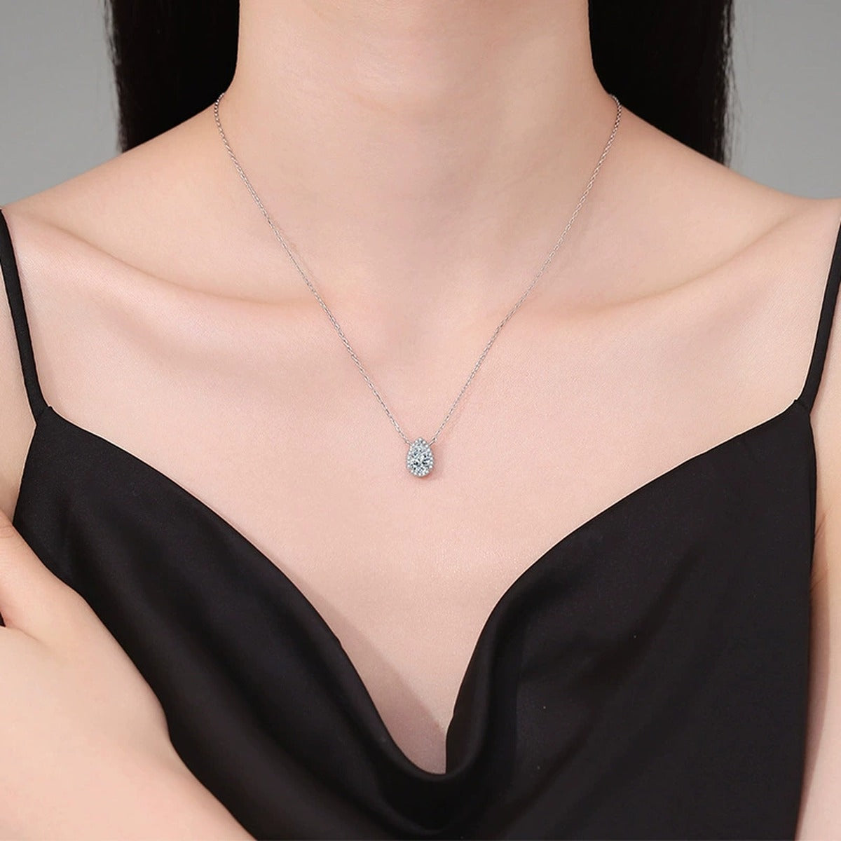 Pear Lab-Grown Gemstone and Moissanite Pendant Necklace in White Gold-Plated S925 Sterling Silver worn on neckline by model