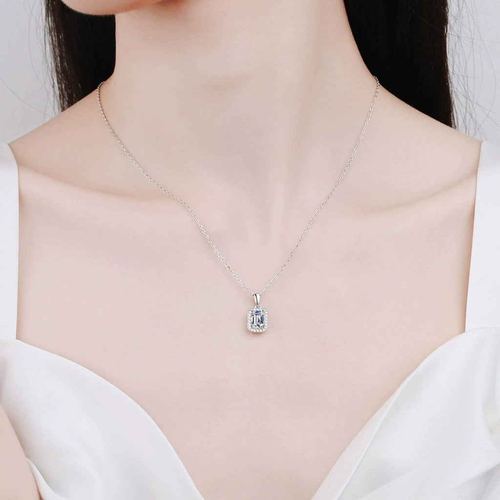 emerald and radiant cut moissanite halo pendant necklace worn by model