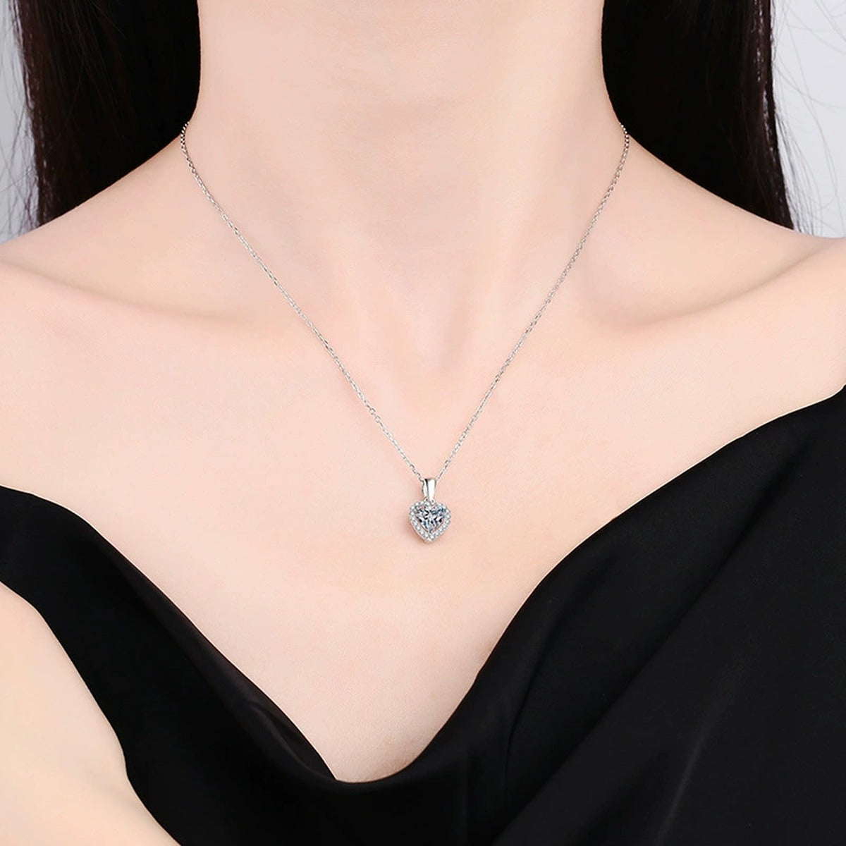heart moissanite halo pendant necklace worn by model