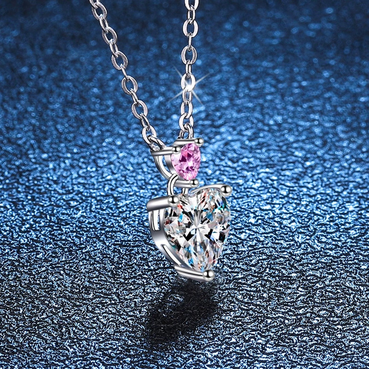 pink accent heart moissanite pendant necklace detail view
