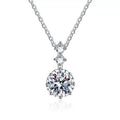 Round Moissanite Pendant Necklace with Cubic Zirconia in White Gold-Plated S925 Sterling Silver on clean white background showing the round moissanite pendant framed by cubic zirconia accents