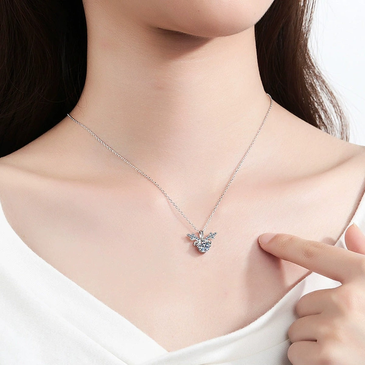 Round Halo Moissanite Pendant Necklace with Cubic Zirconia in White Gold-Plated S925 Sterling Silver worn on neckline by model