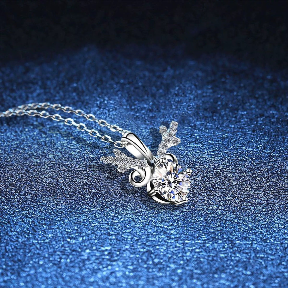 Round Halo Moissanite Pendant Necklace with Cubic Zirconia in White Gold-Plated S925 Sterling Silver blue background angled view