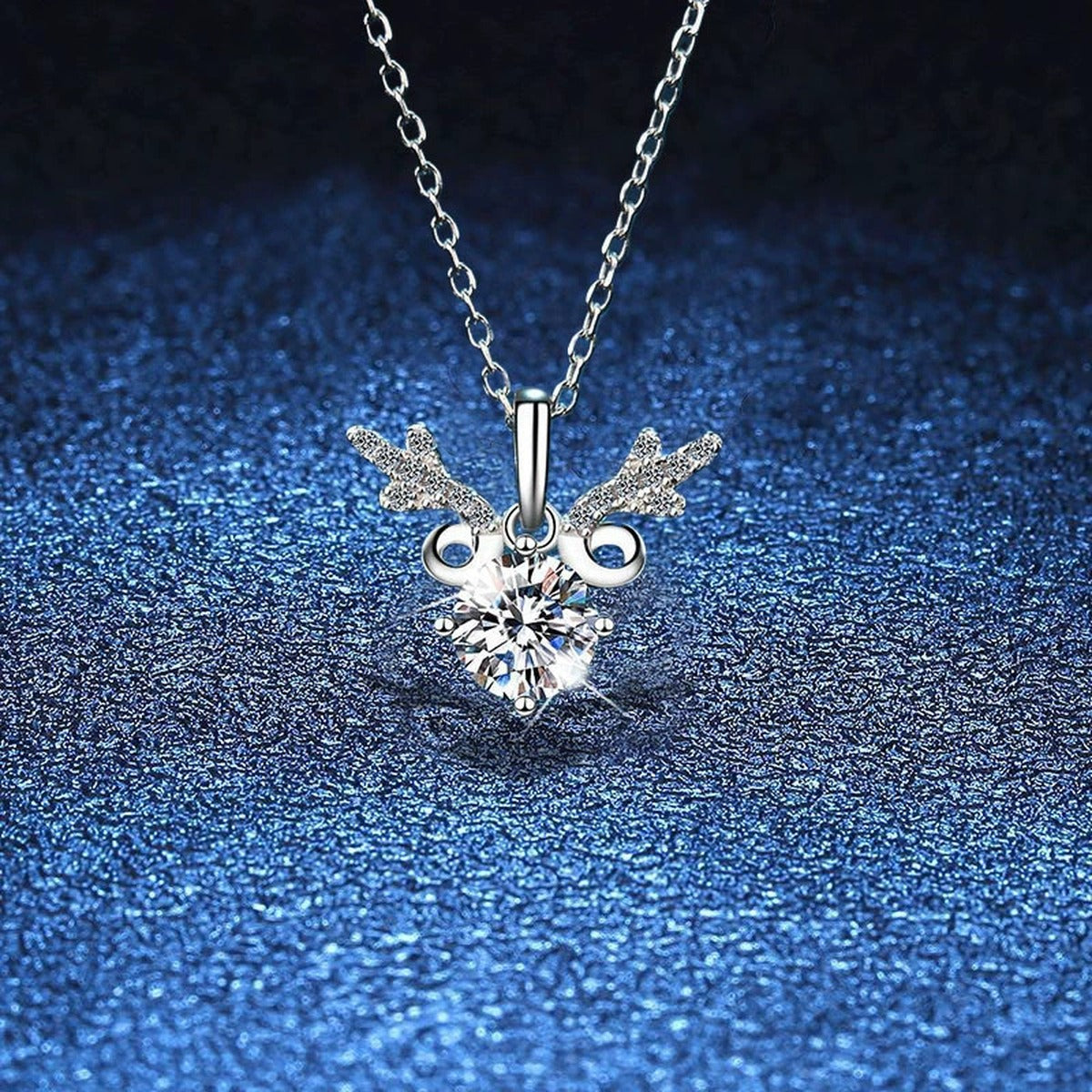 Round Halo Moissanite Pendant Necklace with Cubic Zirconia in White Gold-Plated S925 Sterling Silver blue background close-up view