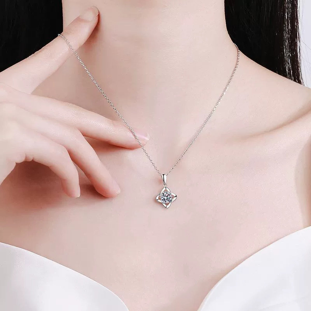 round moissanite solitaire pendant necklace in platinum-plated S925 sterling silver worn by model