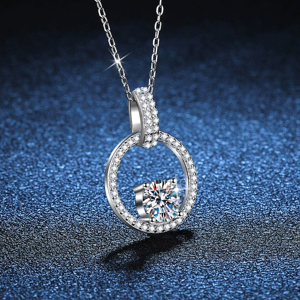 circle halo moissanite pendant necklace with CZ accents in platinum-plated S925 sterling silver close-up detail view