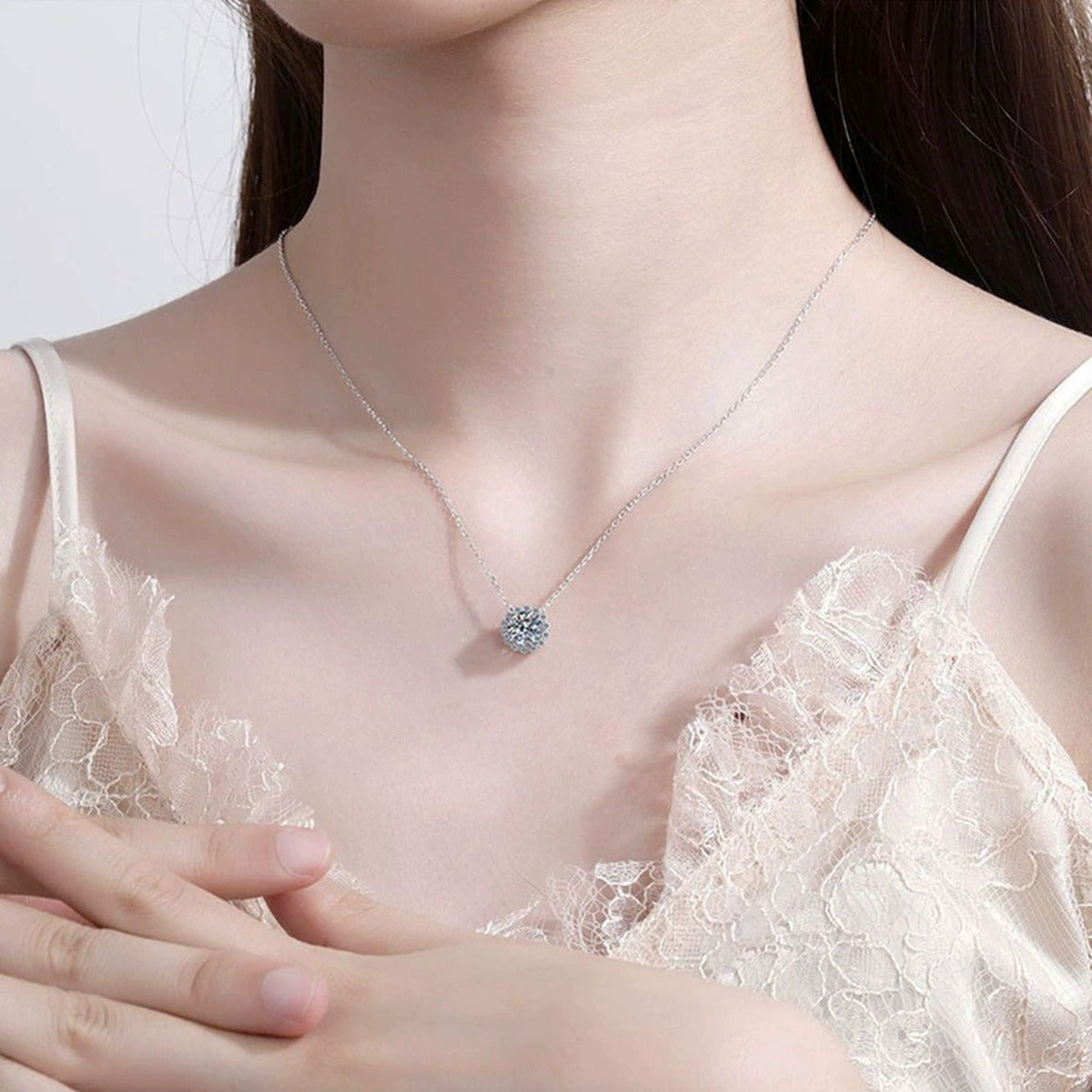 floral halo moissanite pendant necklace with CZ accents in platinum-plated S925 sterling silver worn by model