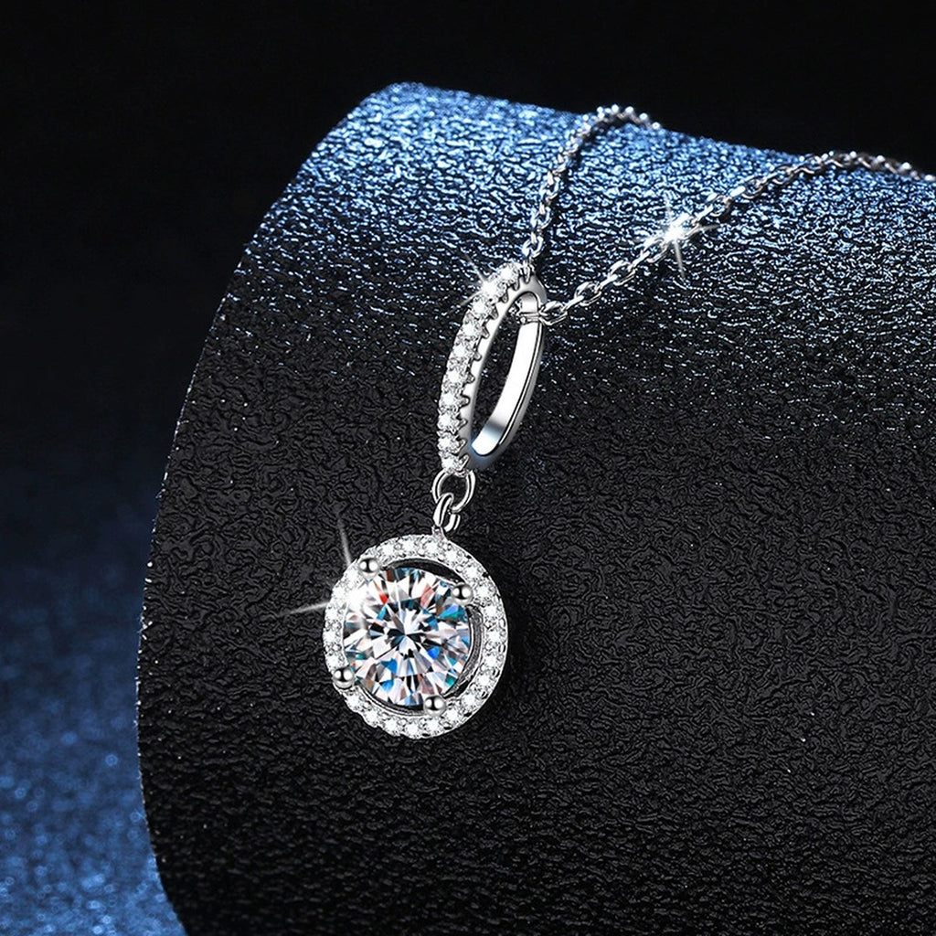 round halo moissanite pendant necklace with CZ accents in platinum-plated S925 sterling silver lifestyle product view