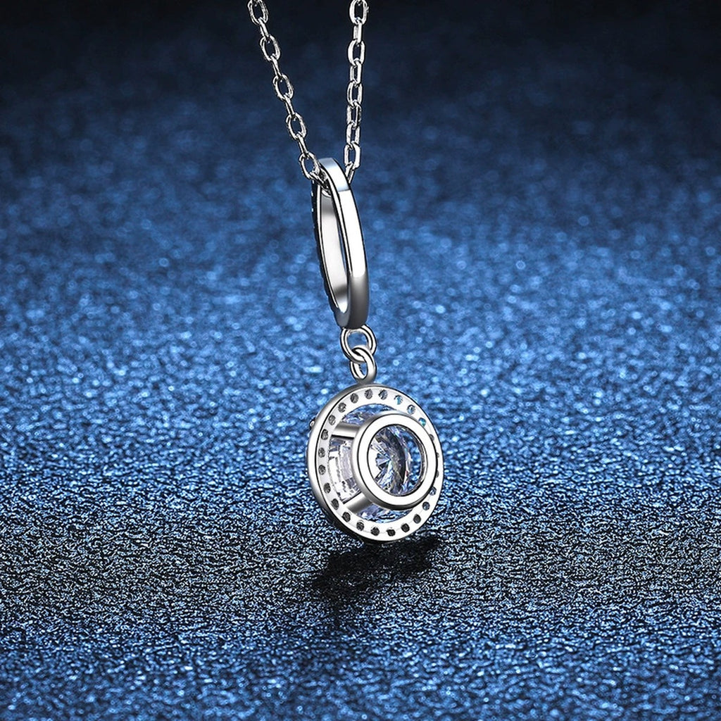 round halo moissanite pendant necklace with CZ accents in platinum-plated S925 sterling silver close-up detail view