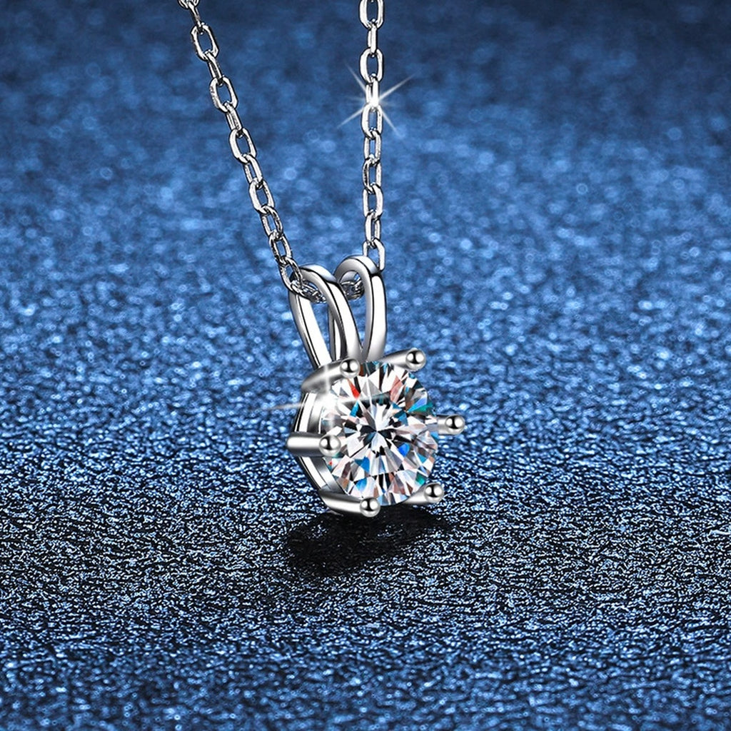 six-prong round moissanite pendant necklace in platinum-plated S925 sterling silver close-up detail view