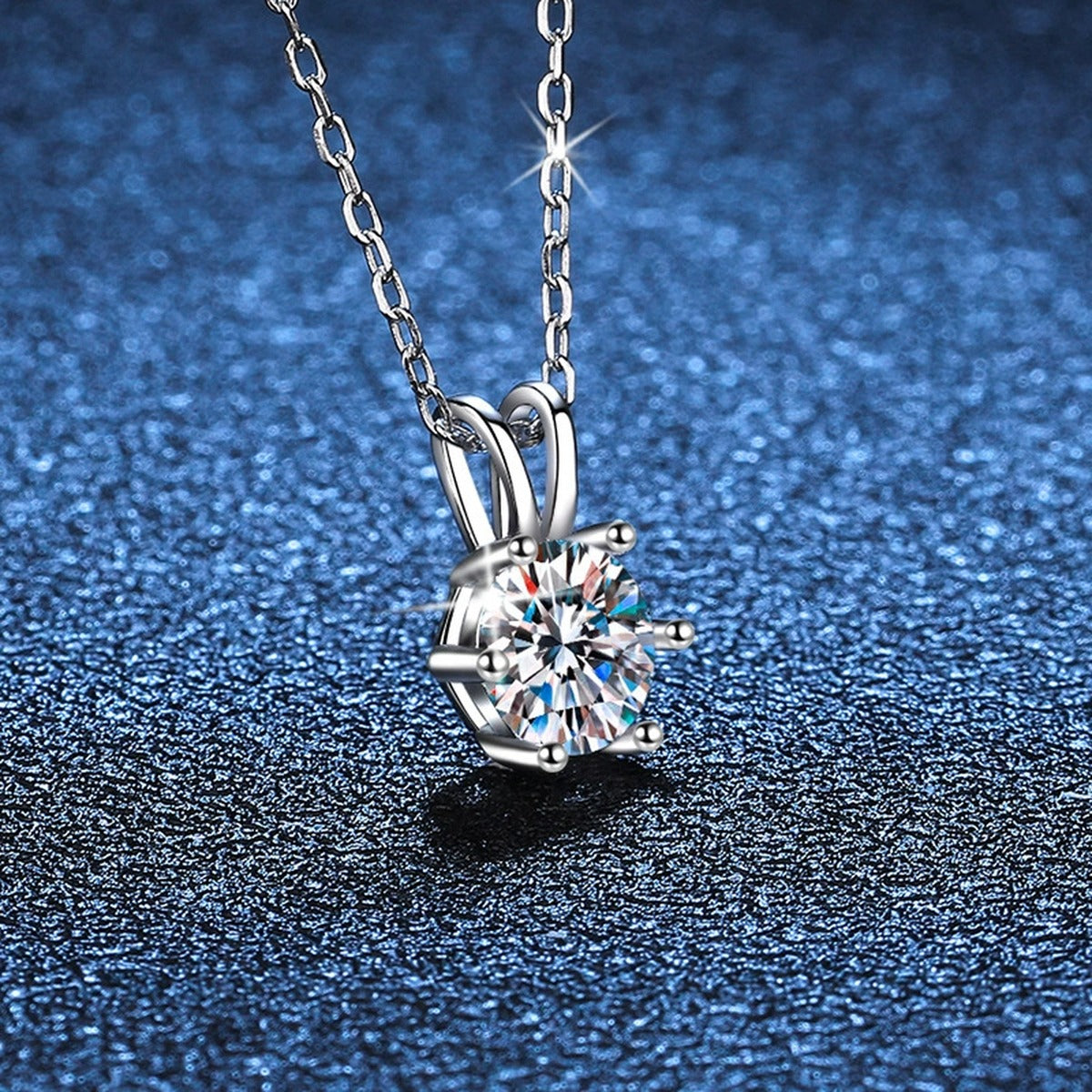 six-prong round moissanite pendant necklace in platinum-plated S925 sterling silver close-up detail view