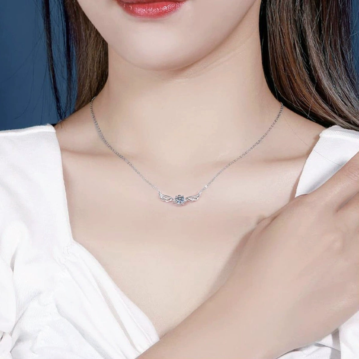 wing moissanite station necklace in platinum-plated S925 sterling silver worn by model