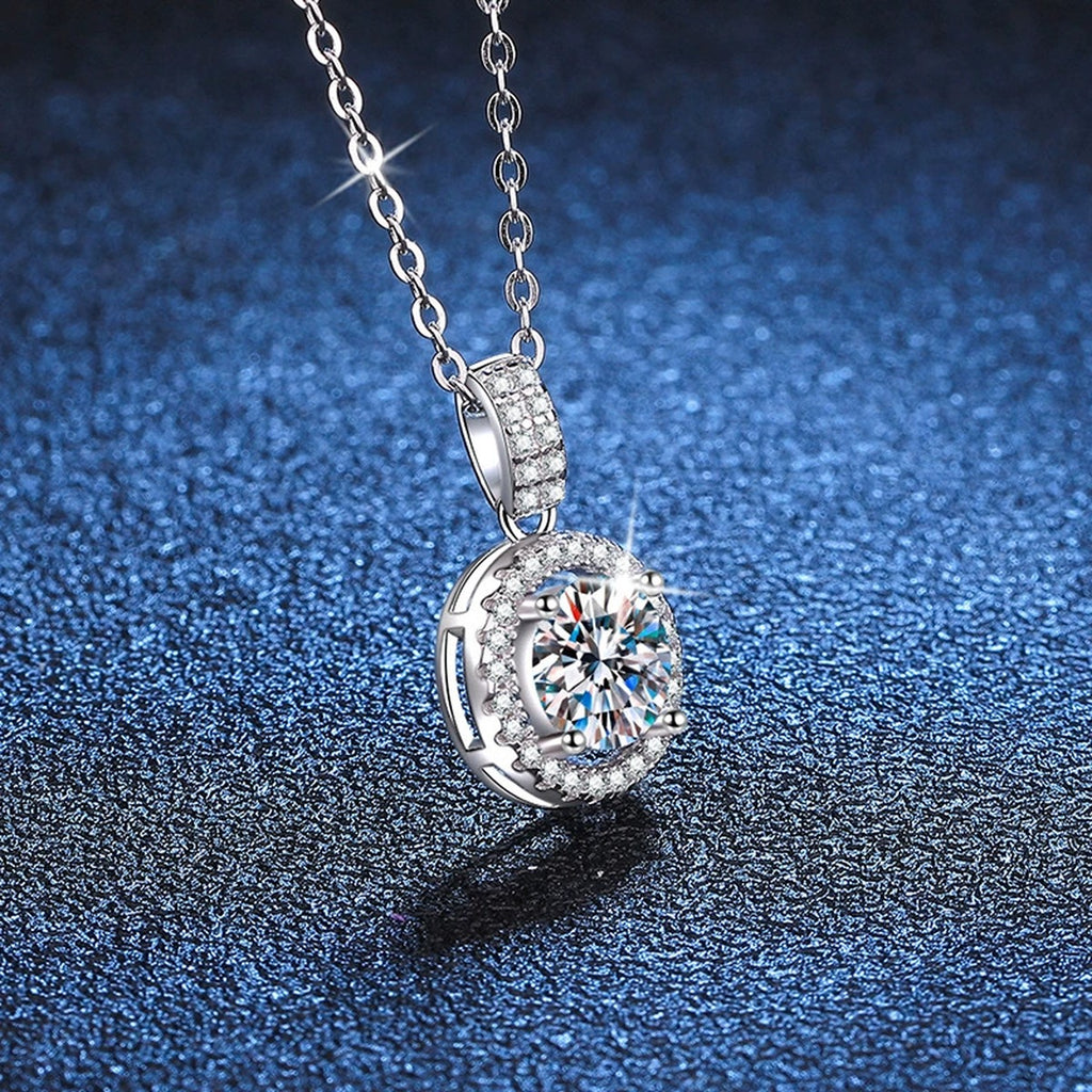 round halo moissanite pendant necklace with CZ accents in platinum-plated S925 sterling silver close-up detail view