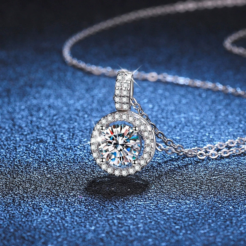 round halo moissanite pendant necklace with CZ accents in platinum-plated S925 sterling silver lifestyle product view