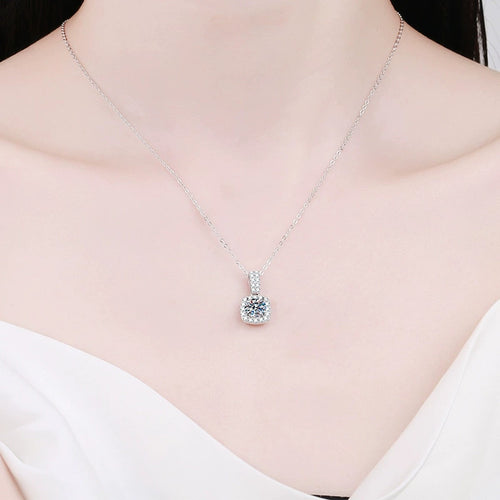 cushion halo moissanite pendant necklace with CZ accents in platinum-plated S925 sterling silver worn by model