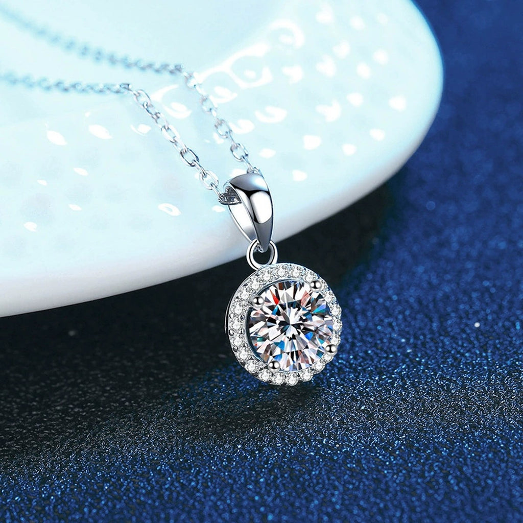 round halo moissanite pendant necklace with CZ accents in platinum-plated S925 sterling silver close-up detail view