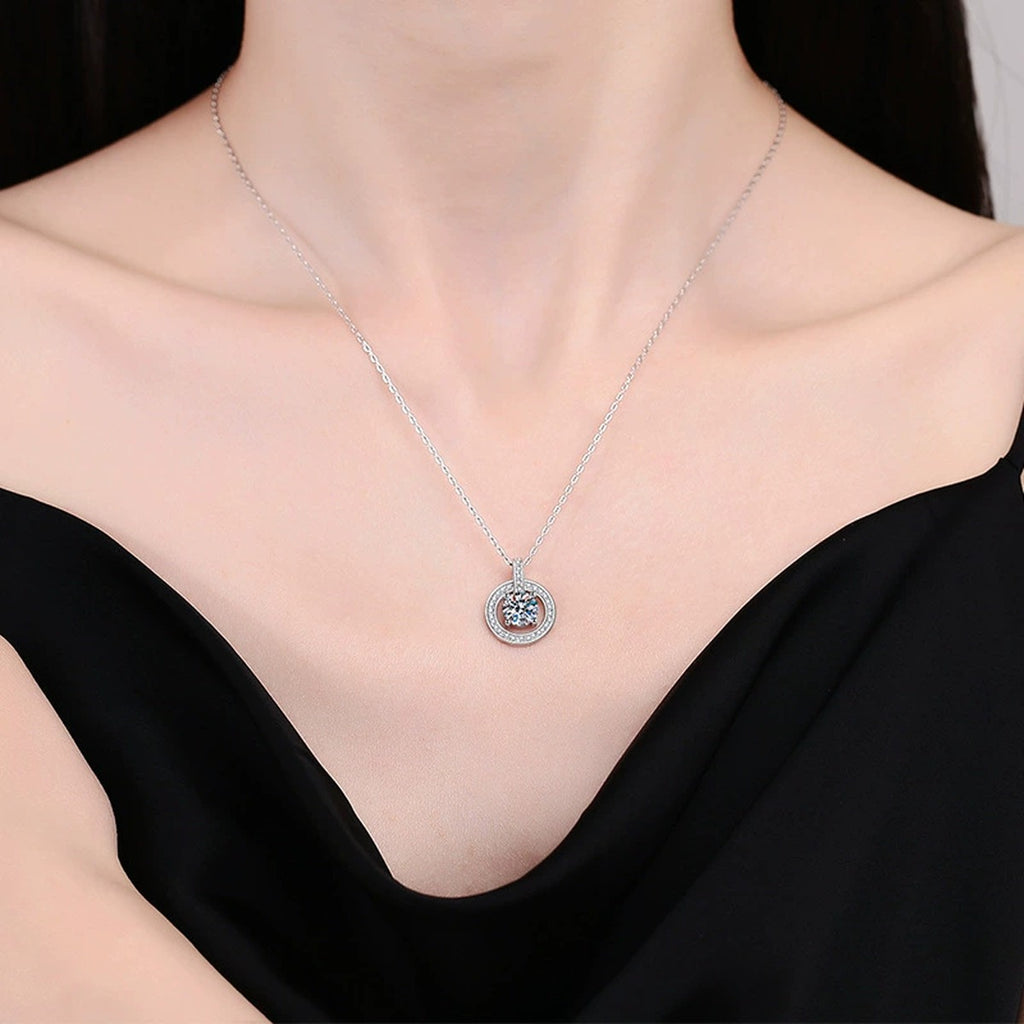 circle drop moissanite pendant necklace with CZ accents in platinum-plated S925 sterling silver worn by model