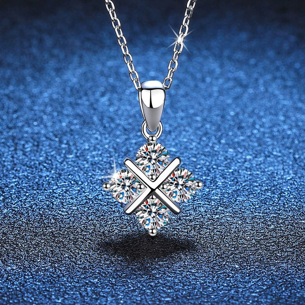 Four-Stone Clover Moissanite Pendant Necklace in Platinum-Plated S925 Sterling Silver blue background close-up view