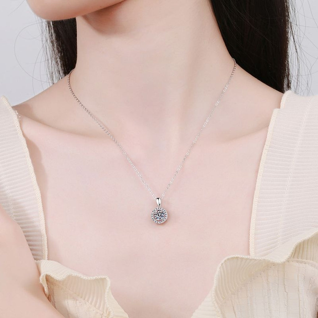 Round Halo Moissanite Pendant Necklace in Platinum-Plated S925 Sterling Silver worn by model at neckline