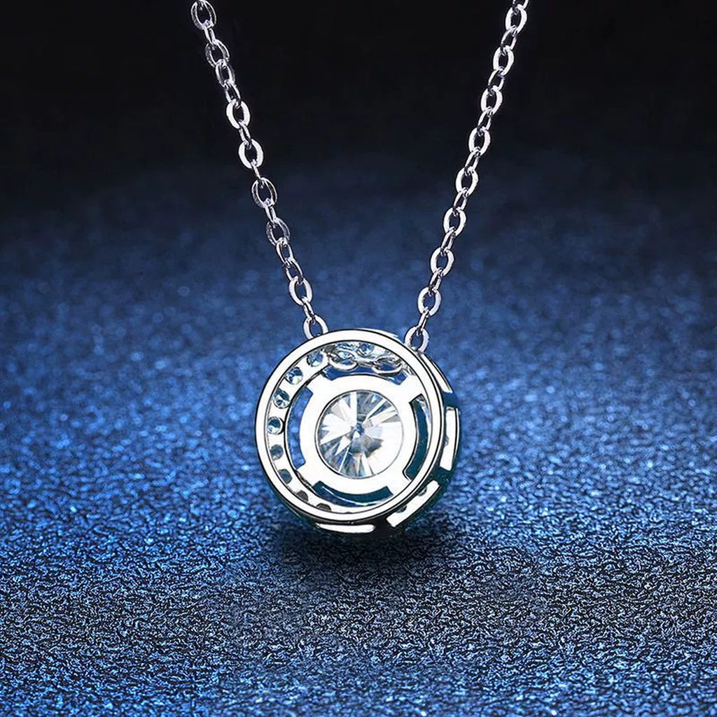 Round Halo Moissanite Pendant Necklace in Platinum-Plated S925 Sterling Silver blue background angled detail view