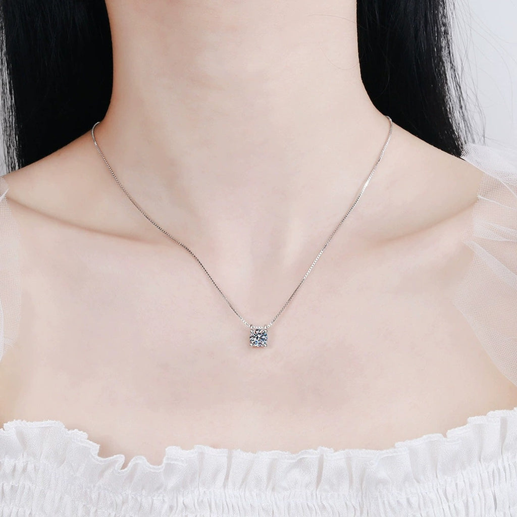 Round Moissanite Solitaire Pendant Necklace in White Gold-Plated S925 Sterling Silver worn on neckline by model
