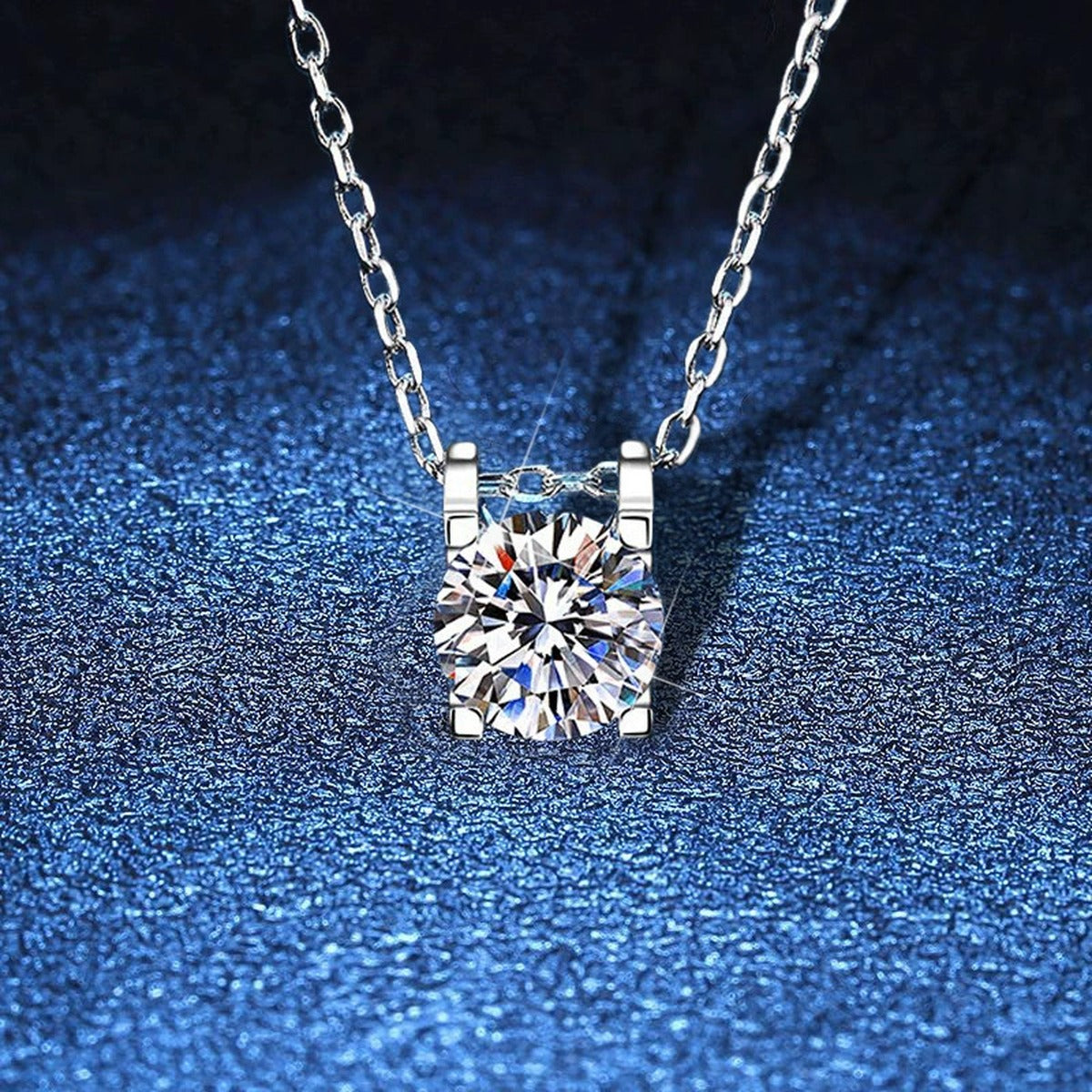 Round Moissanite Solitaire Pendant Necklace in White Gold-Plated S925 Sterling Silver blue background product view