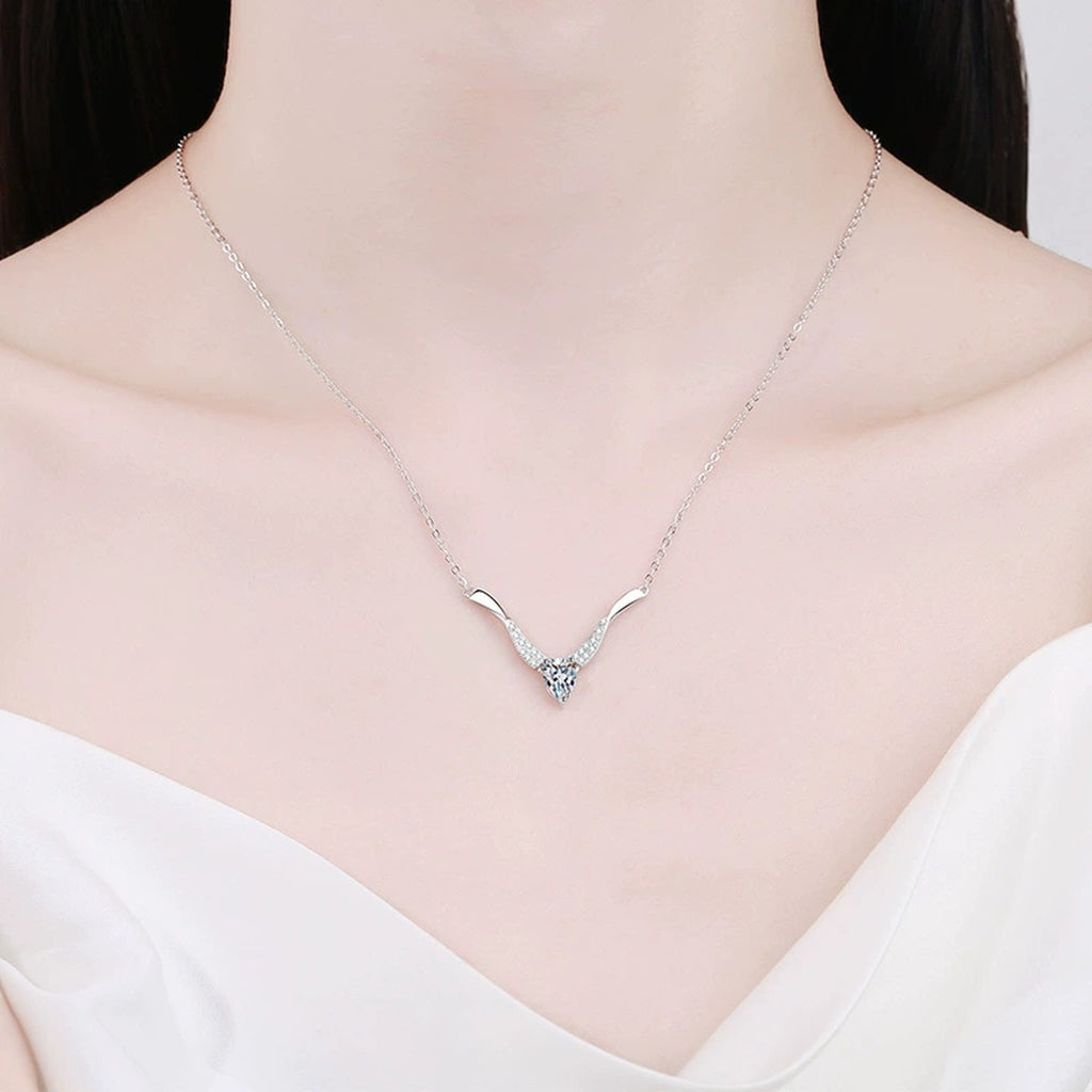 Pear Moissanite Drop Necklace in Platinum-Plated S925 Sterling Silver worn on neckline by model