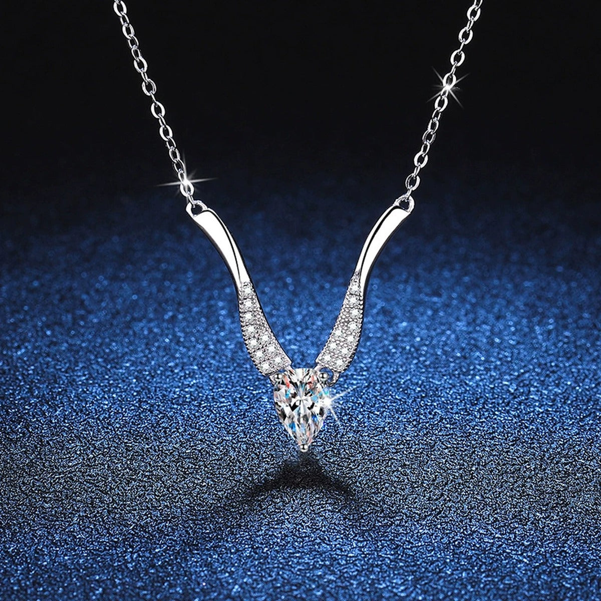 Pear Moissanite Drop Necklace in Platinum-Plated S925 Sterling Silver blue background product view