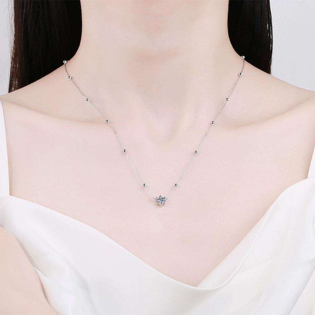 Round Moissanite Station Necklace in Platinum-Plated S925 Sterling Silver worn on neckline by model