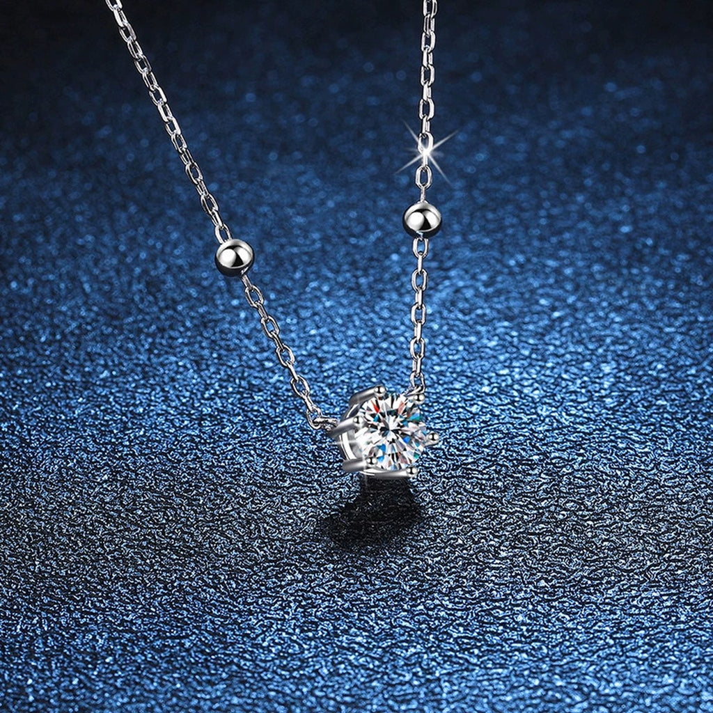 Round Moissanite Station Necklace in Platinum-Plated S925 Sterling Silver blue background angled detail view