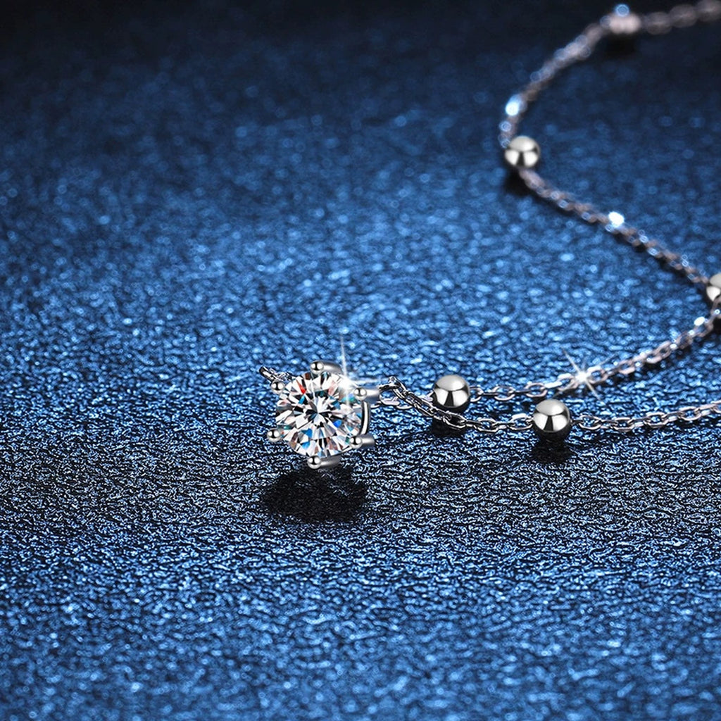 Round Moissanite Station Necklace in Platinum-Plated S925 Sterling Silver blue background close-up view