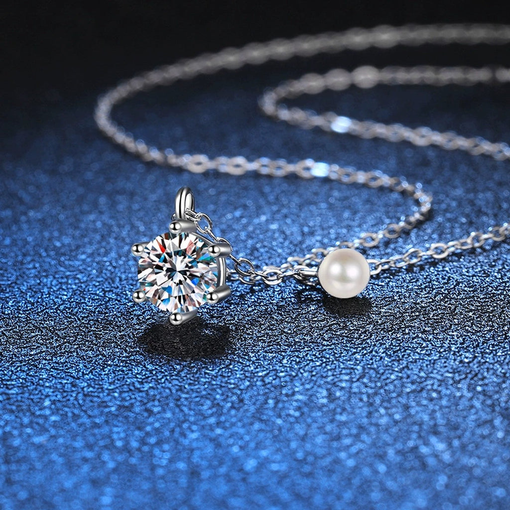 Round Moissanite Pearl Accent Pendant Necklace in Platinum-Plated S925 Sterling Silver blue background angled detail view