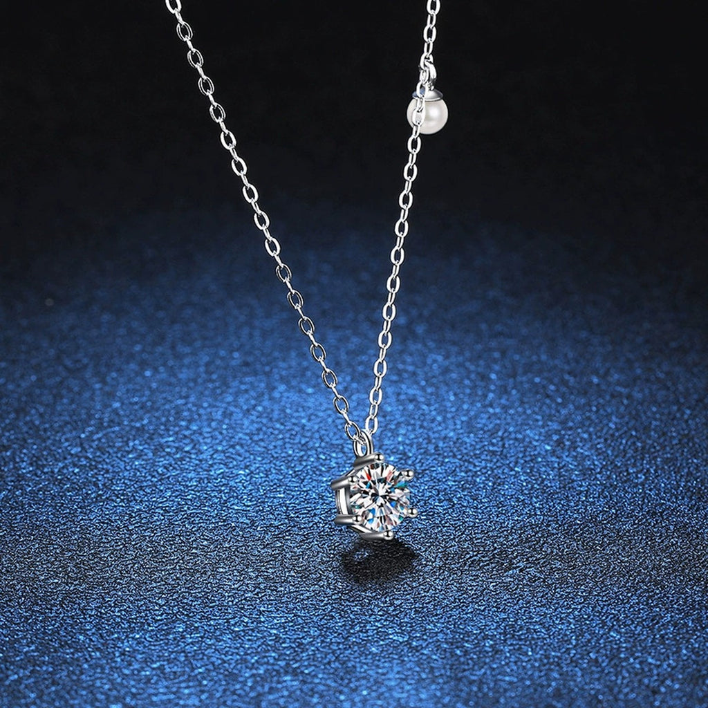Round Moissanite Pearl Accent Pendant Necklace in Platinum-Plated S925 Sterling Silver blue background close-up view