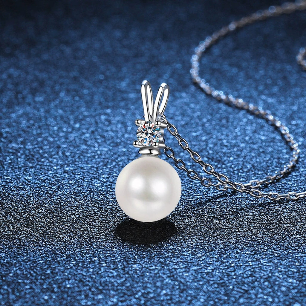 Moissanite Pearl Pendant Necklace in Platinum-Plated S925 Sterling Silver blue background angled detail view