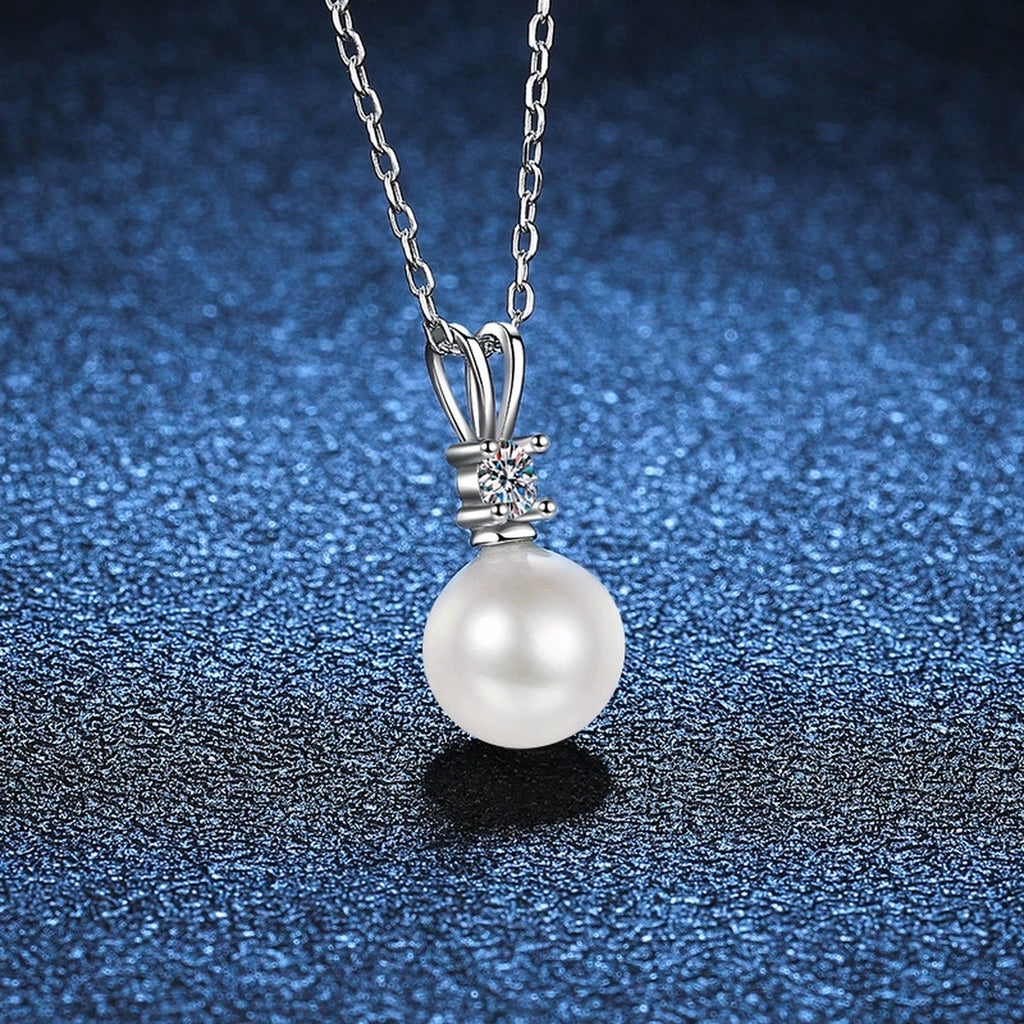 Moissanite Pearl Pendant Necklace in Platinum-Plated S925 Sterling Silver blue background close-up view