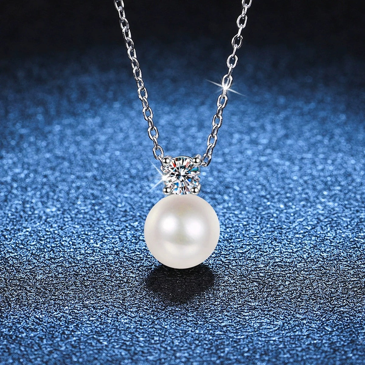 Petite Round Moissanite Pendant Necklace in Platinum-Plated S925 Sterling Silver blue background product view