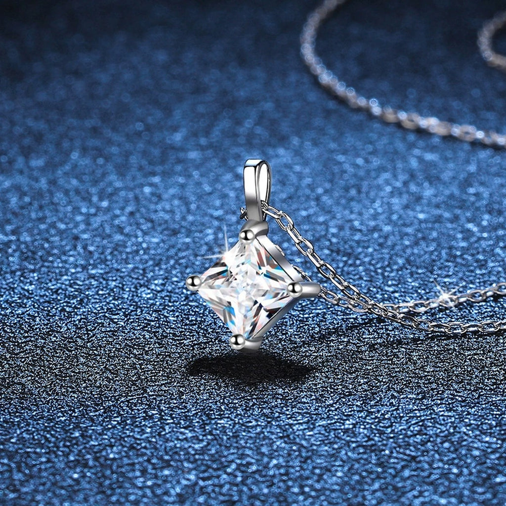 Princess-Cut Moissanite Pendant Necklace in Platinum-Plated S925 Sterling Silver blue background angled detail view