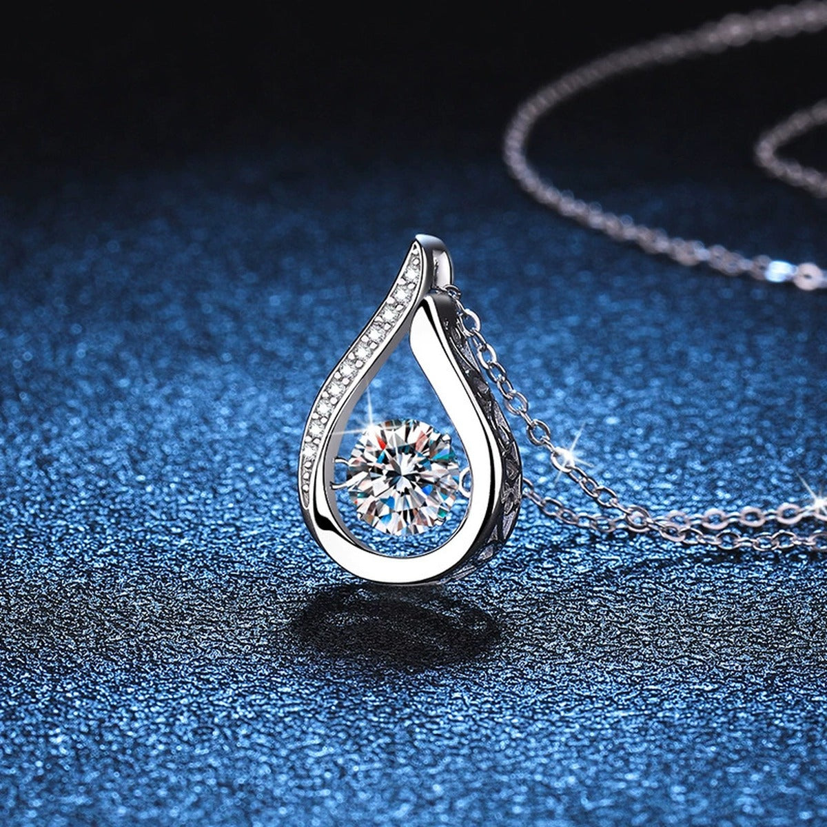 Teardrop Moissanite Pendant Necklace in Platinum-Plated S925 Sterling Silver blue background product view