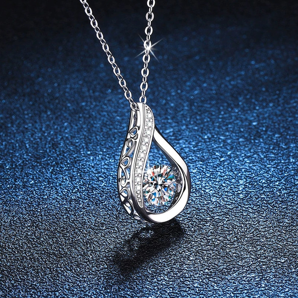 Teardrop Moissanite Pendant Necklace in Platinum-Plated S925 Sterling Silver blue background close-up view