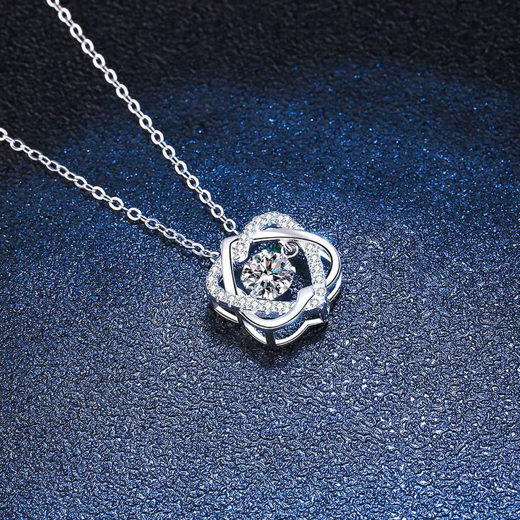 Swirl Round Moissanite Pendant Necklace in Platinum-Plated S925 Sterling Silver blue background close-up view
