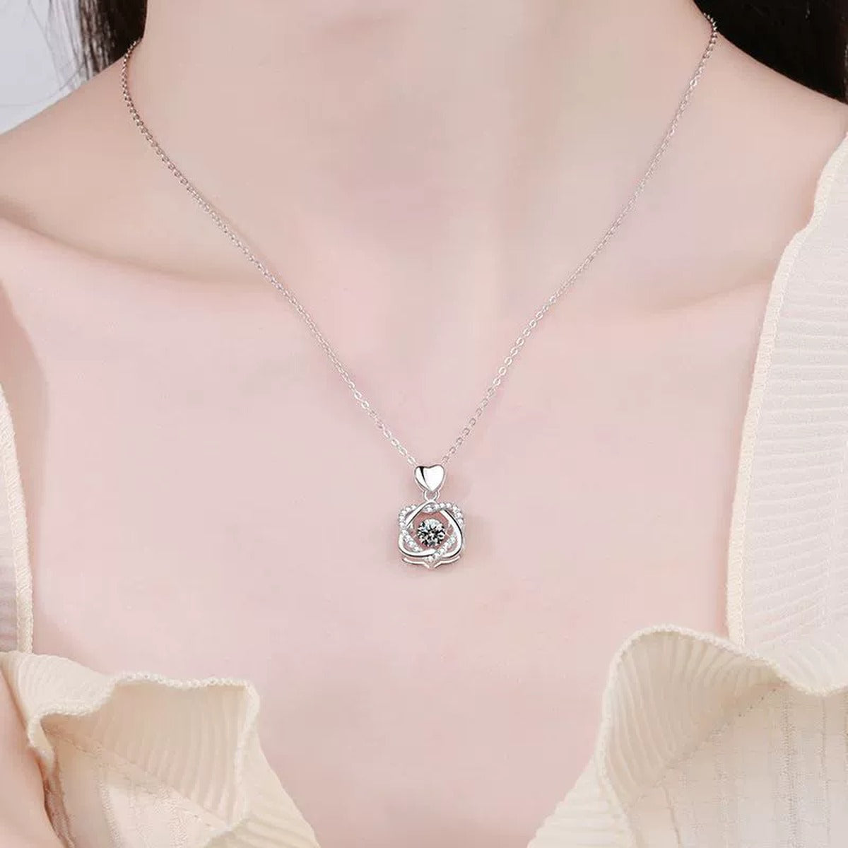 Floral Swirl Moissanite Pendant Necklace in Platinum-Plated S925 Sterling Silver worn by model at neckline