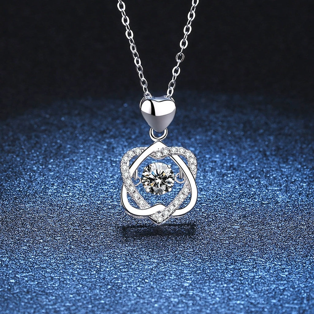 Floral Swirl Moissanite Pendant Necklace in Platinum-Plated S925 Sterling Silver blue background angled detail view