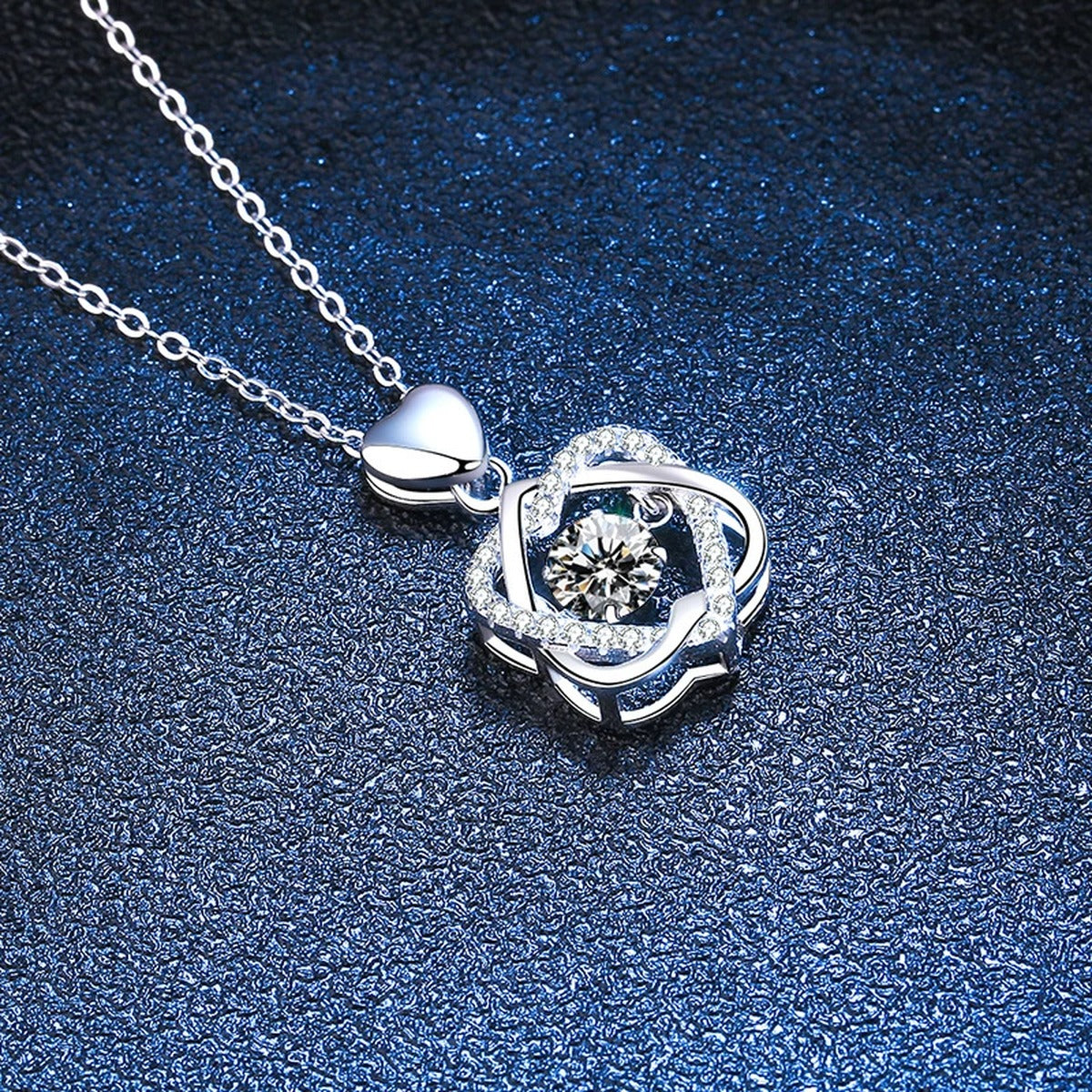 Floral Swirl Moissanite Pendant Necklace in Platinum-Plated S925 Sterling Silver blue background close-up view