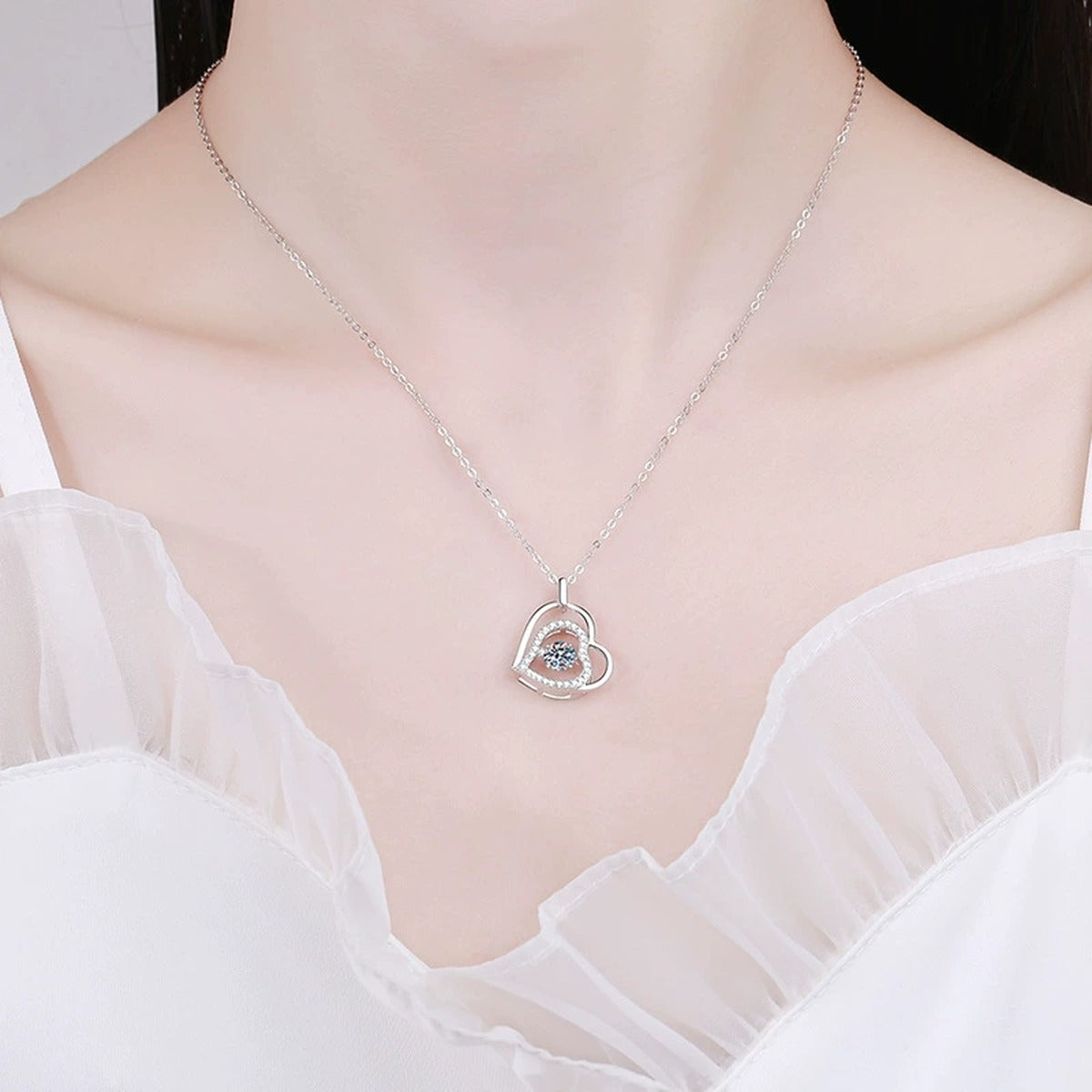 Heart Halo Moissanite Pendant Necklace in Platinum-Plated S925 Sterling Silver worn on neckline by model