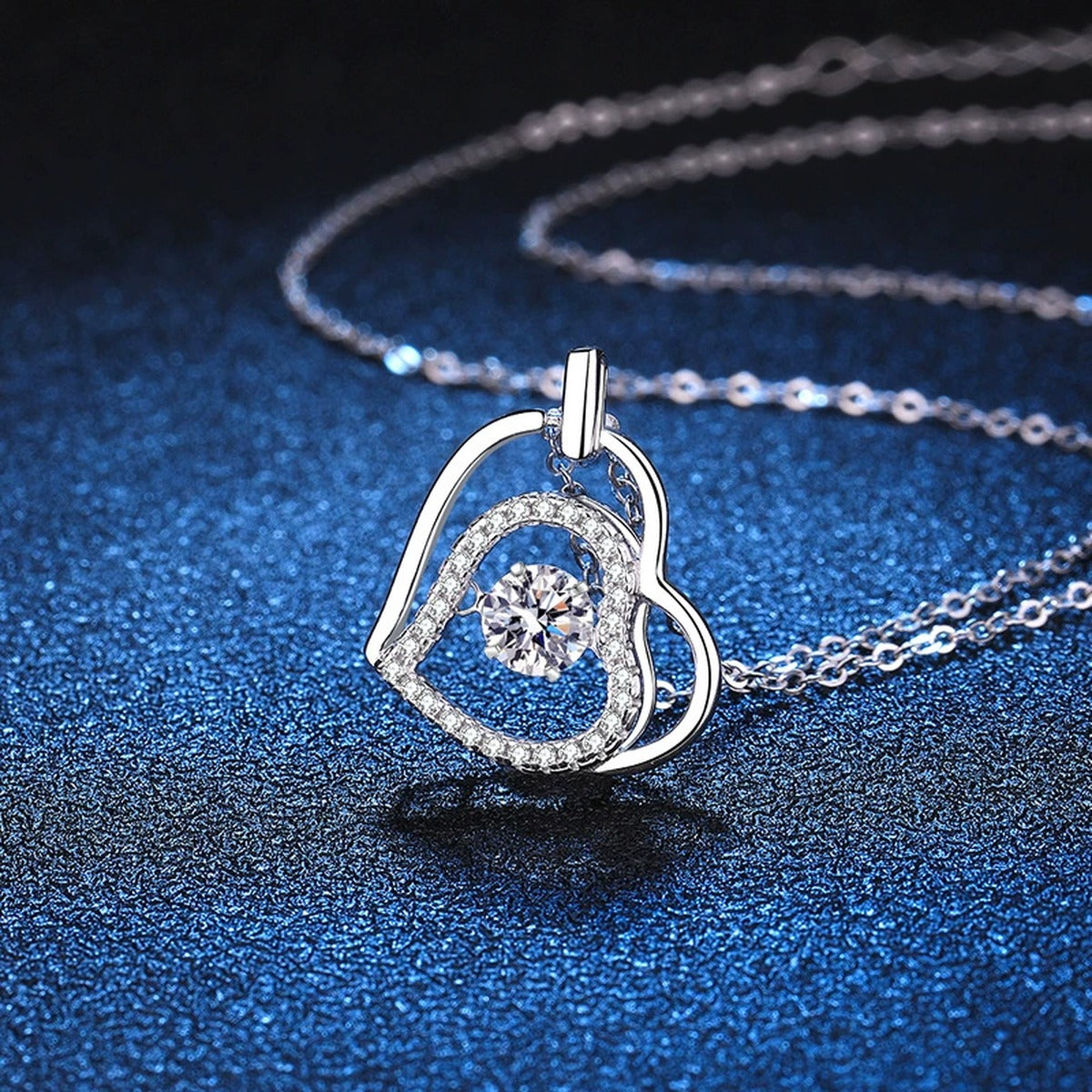 Heart Halo Moissanite Pendant Necklace in Platinum-Plated S925 Sterling Silver blue background angled detail view