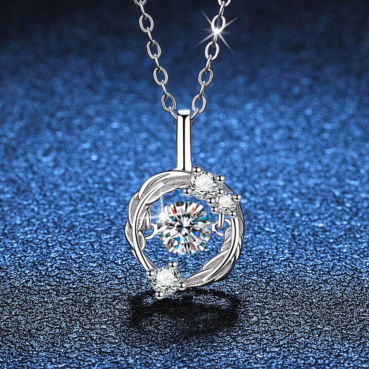 Open Circle Moissanite Pendant Necklace in Platinum-Plated S925 Sterling Silver blue background angled detail view