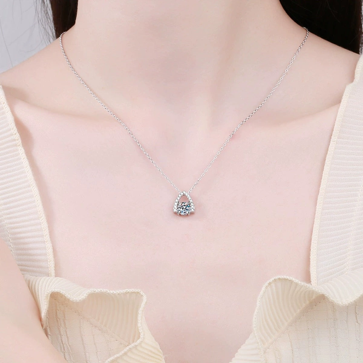 Arch Halo Moissanite Pendant Necklace in Platinum-Plated S925 Sterling Silver worn on neckline by model