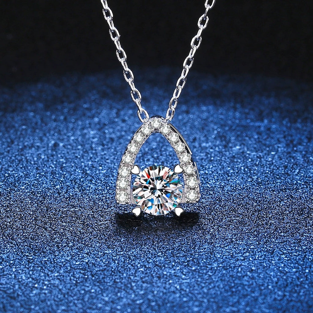 Arch Halo Moissanite Pendant Necklace in Platinum-Plated S925 Sterling Silver blue background angled detail view